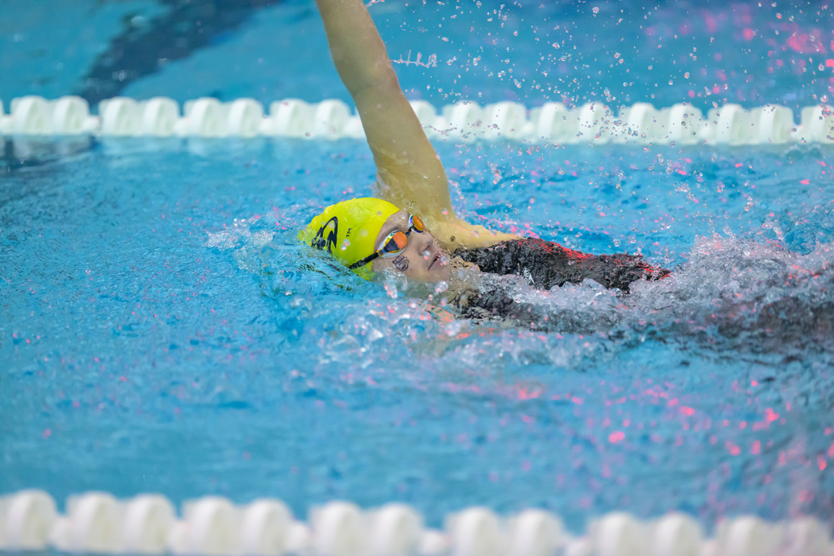 Female athlete participating in the backstroke